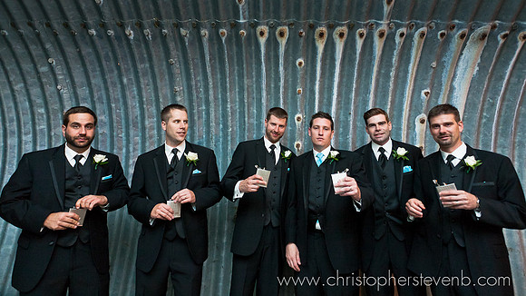 funny groomsmen drinking from flask at Ottawa wedding