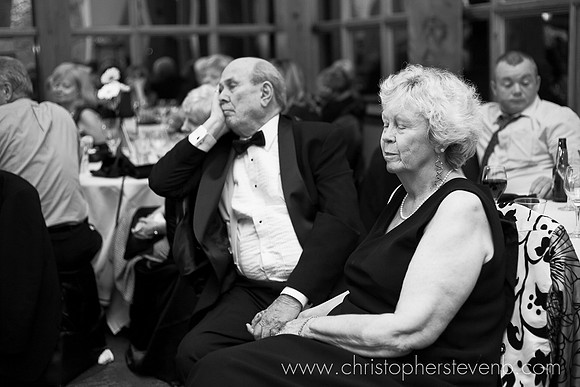 funny wedding photo of couple sleeping during speeches