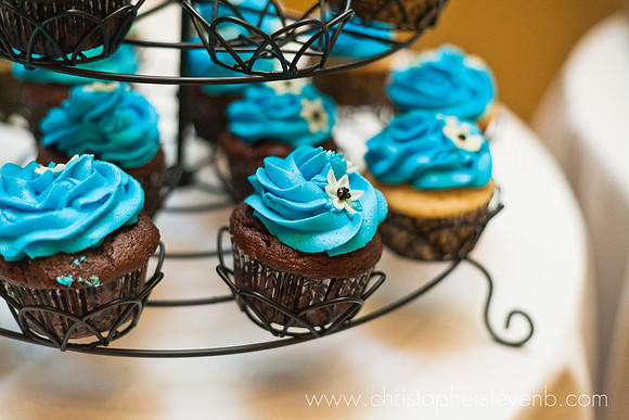 chocolate cupcakes with blue icing at wedding