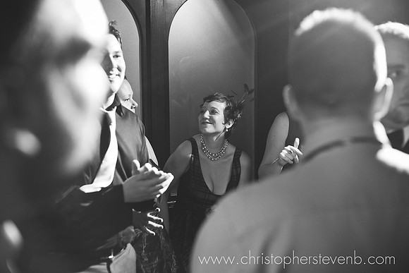 glamourous black and white of woman with fascinator dancing