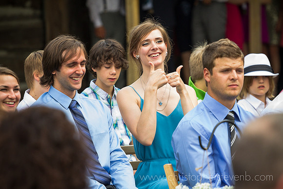 thumbs up for groom during wedding ceremony