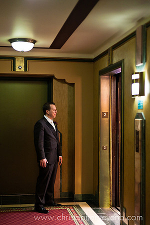 groom waiting outside of elevator