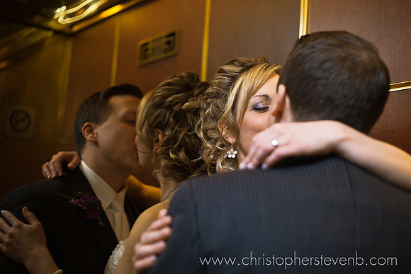 bride and groom kissing on Lord Elgin Hotel elevator