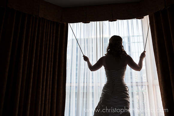 silhouette of bride in front of window