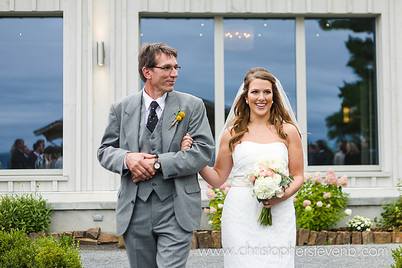 bride and her father smiling with Le Belvedere venue behind