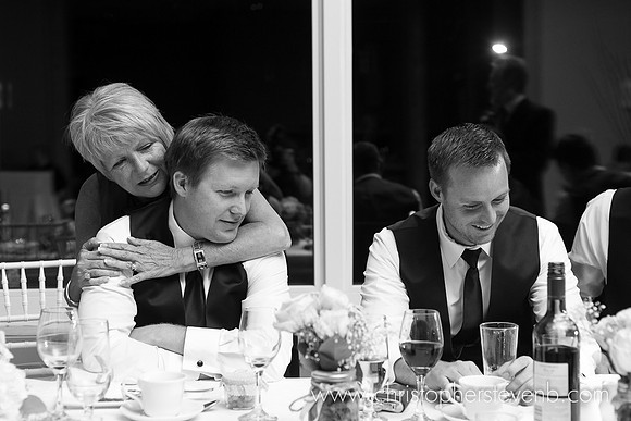 mother hugging groom