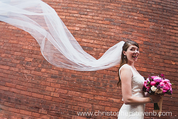 Bride with veil flying at Ottawa wedding