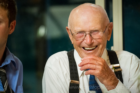 grandfather smiling at Saunders Farm wedding