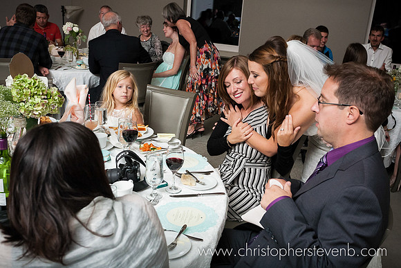 bride hugging wedding guest