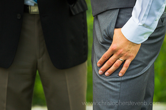 funny shot of groom showing off ring durnig wedding ceremony