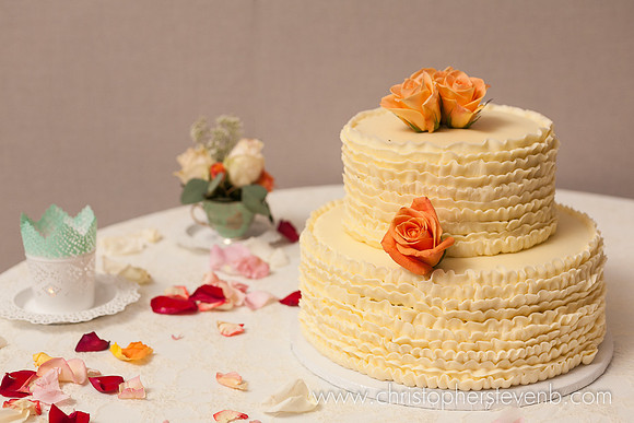 wedding cake with orange flowers