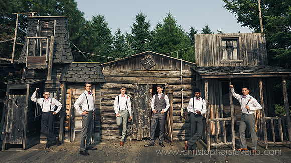 Saunders farm wooden stage facade wih groomsmen